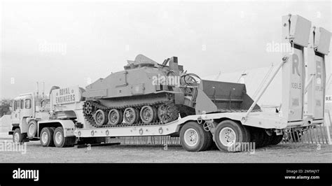 A Royal engineers Combat Engineer Tractor, on its road transporter, at ...