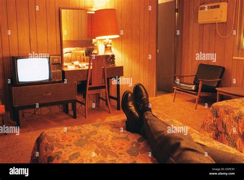 Person watching television in cheap motel room Stock Photo - Alamy