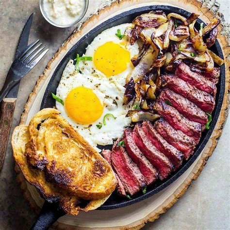 Grilled Steak and Eggs with Caramelized Onions on Artisan Sourdough Bread