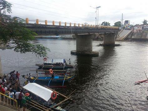 ABS-CBN News on Twitter: "People cross the Calumpang River by boat, as ...