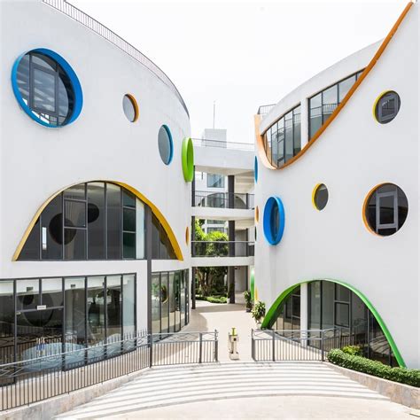 A new #kindergarten in #Vinh, designed by #LAVA, unfolds three semi-circular buildings over ...