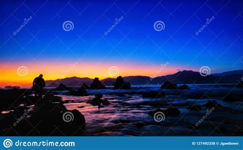 Pulau Merah beach stock photo. Image of twilight, blue - 127492338