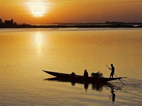 'Mopti, at Sunset, a Boatman in a Pirogue Ferries Passengers across the Niger River to Mopti ...