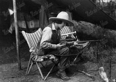 Osa Johnson Cleaning Her Rifle Before a Game Run 1927 B237 | Martin and ...