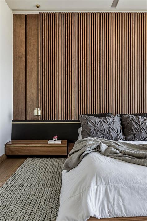 An Accent Wall Of Vertical Wood Helps To Accentuate The Feeling Of Height In This Bedroom ...