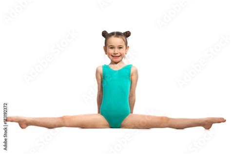 Little girl gymnast sitting in the splits. Isolated on white - Buy this stock photo and explore ...