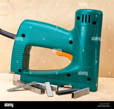 The tool - an electrical stapler for repair work i Stock Photo - Alamy