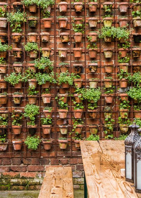 Design Sleuth: Vertical Garden of Terra Cotta Pots - Gardenista