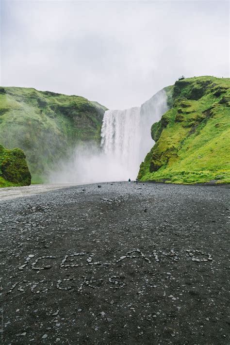 "Skogafoss Waterfall With A Message Built With Stones" by Stocksy ...