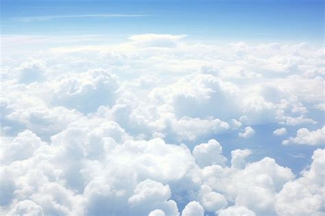 This photo with the theme of seeing white clouds from an airplane | Premium AI-generated image