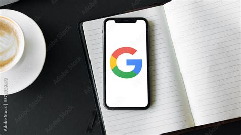 Mobile phone with the Google Logo on the screen Stock Photo | Adobe Stock