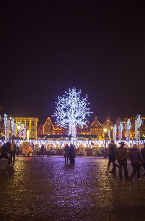 Lit up ice rink and Christmas Market in the Markt in Brugge (Bruges ...