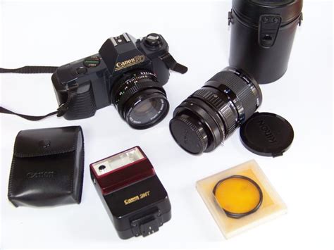 Canon T50 with 2 lenses and various accessories - Catawiki