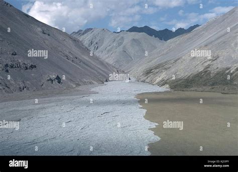 The chandalar river flowing through the mountains Stock Photo - Alamy