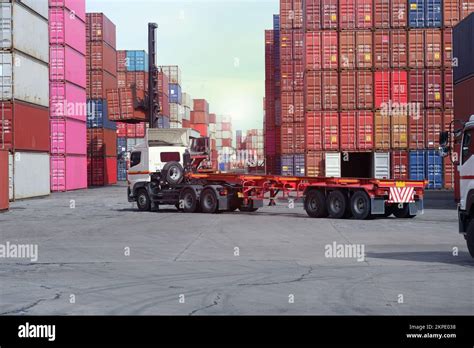 Trucks in the container yard Stock Photo - Alamy