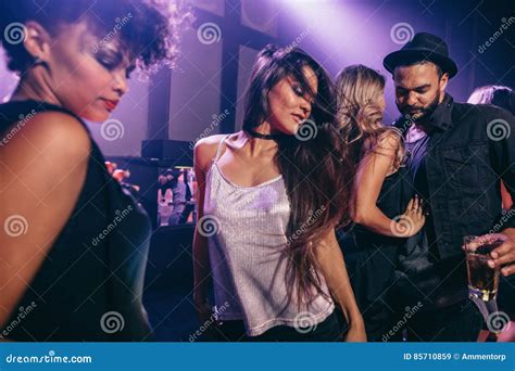 Woman Dancing at Party with Friends at Nightclub Stock Image - Image of ...