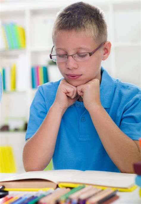 Young Boy with Glasses Learns from Books Stock Photo - Image of friendly, lesson: 34455016