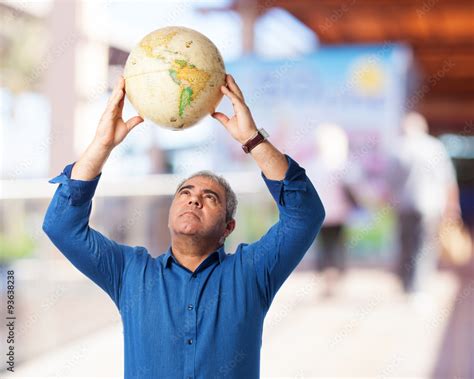 man holding world globe Stock Photo | Adobe Stock