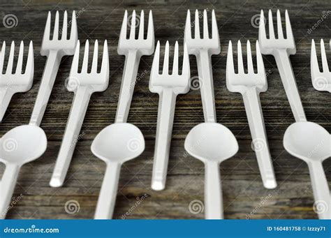 Plastic Cutlery. Disposable Plastic Forks and Spoons on Wooden Background Stock Photo - Image of ...