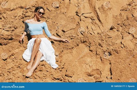 Young Woman is Wearing Sunglasses on the Beach Stock Image - Image of gold, fashion: 168526177