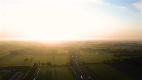 Aerial view of a road and a sunset 27541208 Stock Video at Vecteezy