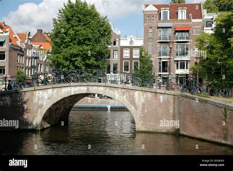 Canal and bridge, Amsterdam, Netherlands Stock Photo - Alamy