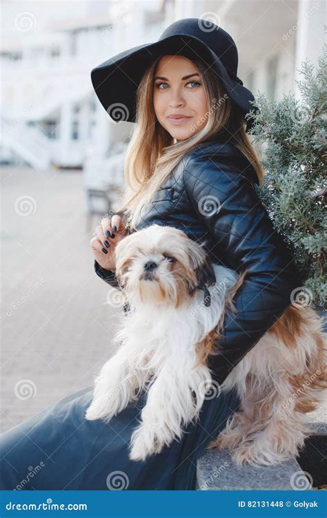 Woman with Small Dog in City Street. Stock Photo - Image of blue, lady ...