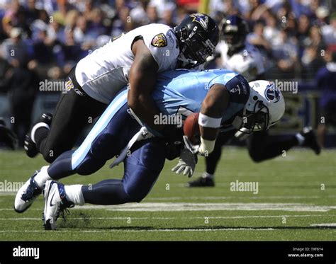 Baltimore Ravens Ray Lewis tackles Tennessee Titans running back Len Dale White during the ...