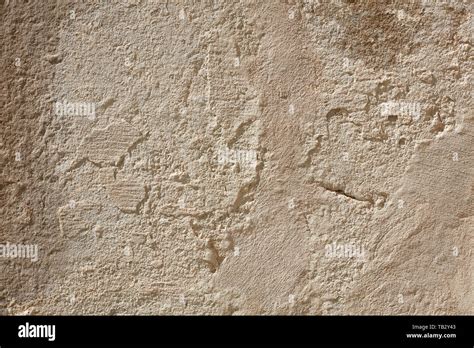 Old beige chipped wall texture background Stock Photo - Alamy