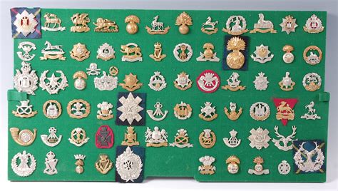 A collection of British Army cap badges and insignia, mainly Infantry ...