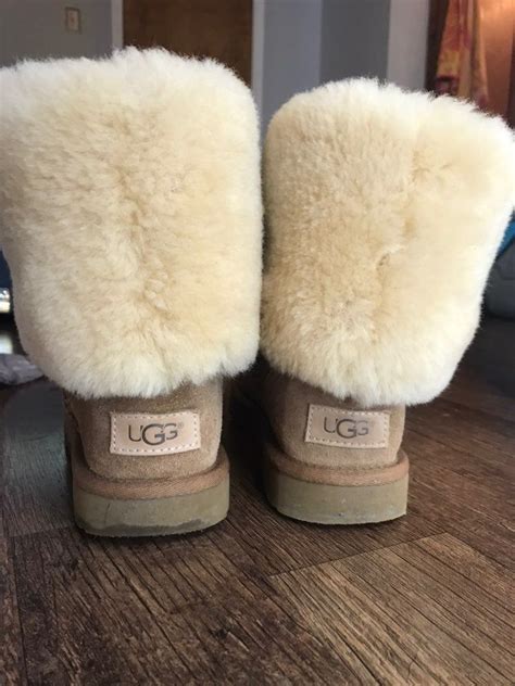 Gently used tall ugg boots, folded over. Only imperfections is creasing. You most likely will ...