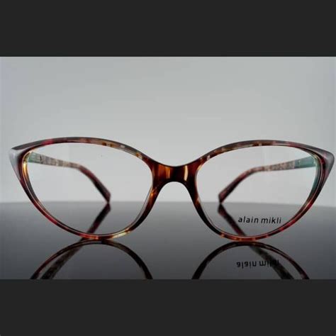 Alain Mikli A03081 is a new release eyeglass frame. The A03081 is a new ...