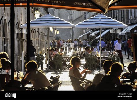 People in restaurants and cafes at the Stradun in Dubrovnik Stock Photo ...