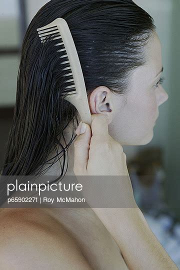 Woman Combing Hair - Stock Image - Everypixel