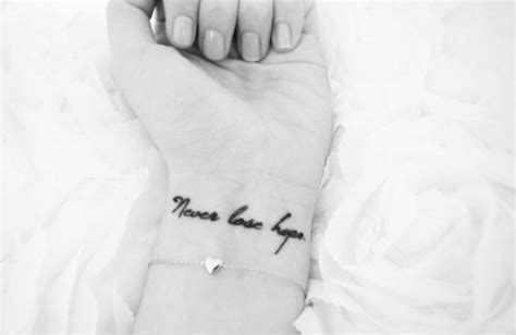 Wrist tattoo saying "Never lose hope" on Vanessa.