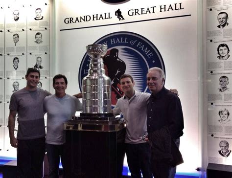 Standing next to the Stanley Cup, at the hockey Great Hall of Fame ...