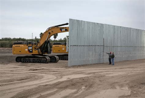 Trump's wall blows over again! Viral video shows wall collapsing under ...