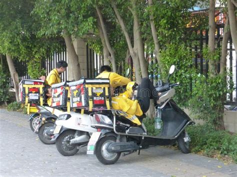 Shenzhen, China: Street Couriers Deliver Food or Wait for a Break Editorial Photo - Image of ...