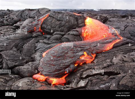 Solidifying pahoehoe type basaltic lava flow Stock Photo - Alamy