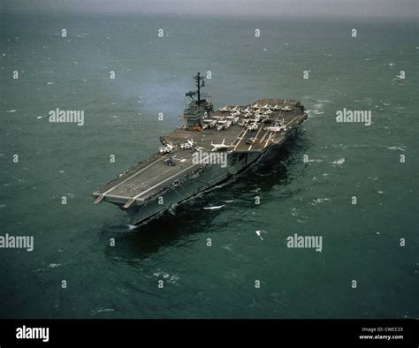 Vietnam War. USS FORRESTAL one month after mishandled explosives killed ...