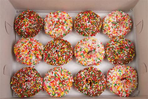 Large Box of Cake Donuts with Sprinkles Stock Photo - Image of international, icing: 182369478