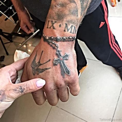 30 Superb Cross Tattoos On Hand