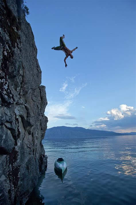 Young Man Jumping Off A Cliff Photograph by Patrick Orton - Fine Art America