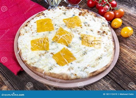 Four Types of Cheese Italian Pizza on a Wooden Floor Stock Image ...