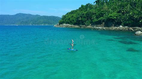 Ocean, Island and Woman Paddle Boarding from Drone with Blue Water, Adventure and Tropical ...