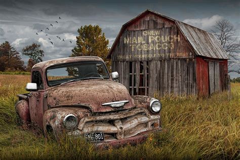 Rusted Chevy Pickup Truck in a Rural Landscape by a Mail Pouch Tobacco Barn Photograph by ...