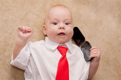 Newborn baby talking on mobile phone — Stock Photo © Vitalinka #11590314