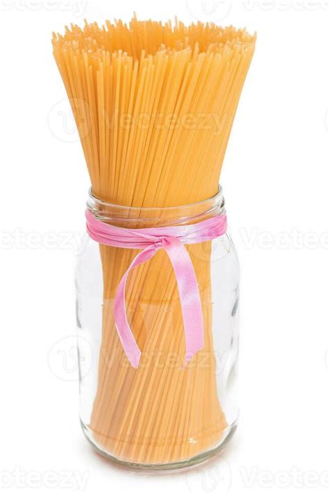 Dry Uncooked Spaghetti in a Glass Jar Isolated on White Background. Raw ...