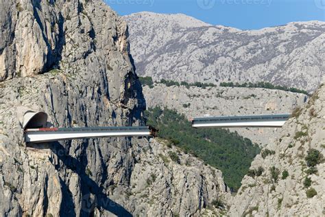 Unfinished bridge in Omis, Croatia over the river Cetina. Bridge being built in between the ...