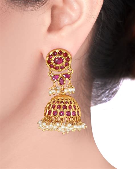 Golden flower ruby jhumka with pearls by Joules By Radhika | The Secret ...